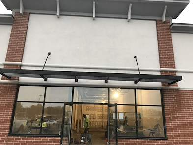 A minimal metal-and-glass canopy