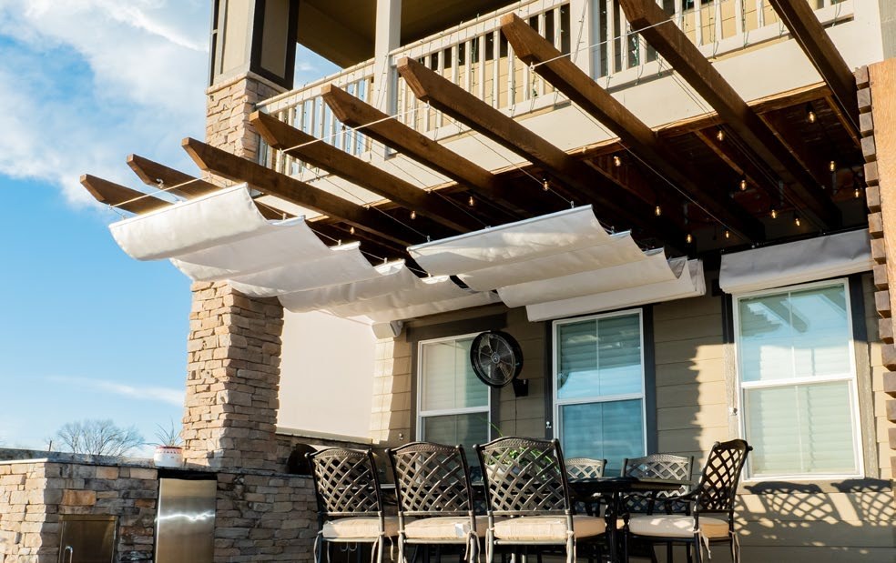 Slide-on-wire fabric canopy installed on a residential pergola