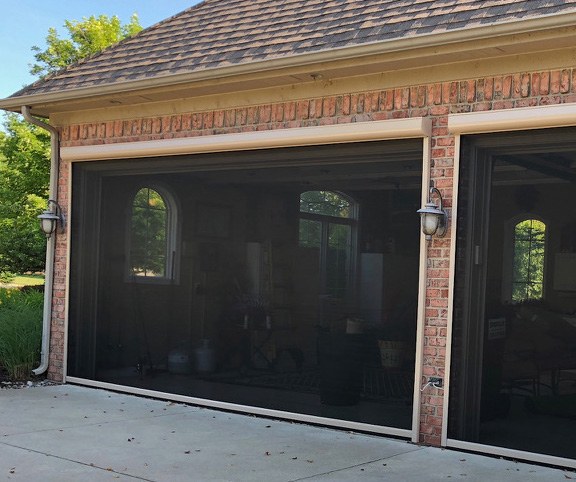 Motorized coverage for a garage